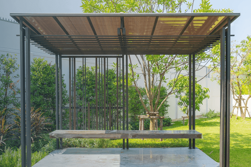 a bench under a pergola