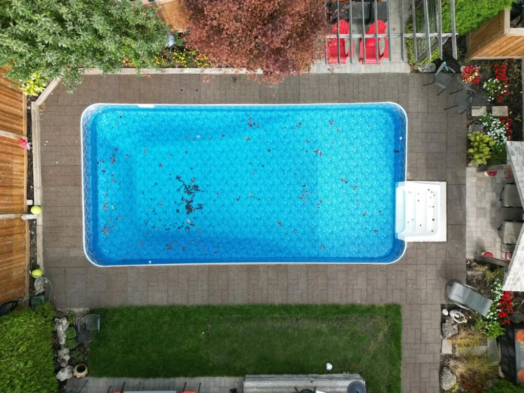 overhead view of interlocking surrounding an outdoor pool