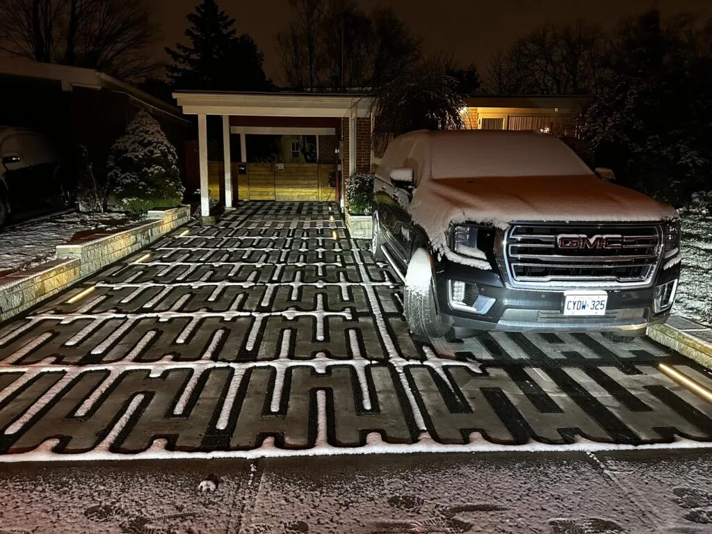 heated driveway melting snow with a pickup truck on the driveway