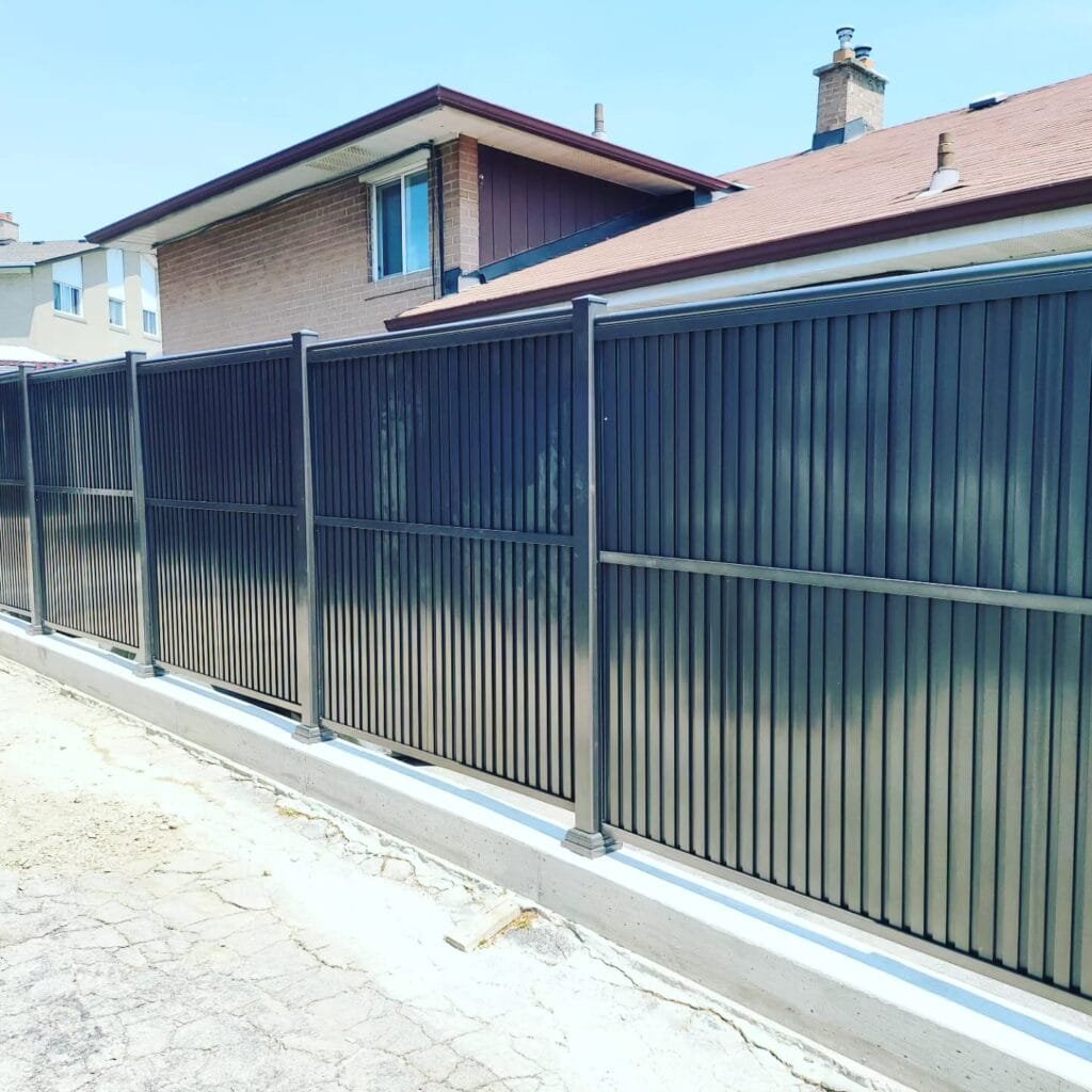 a fence next to a house
