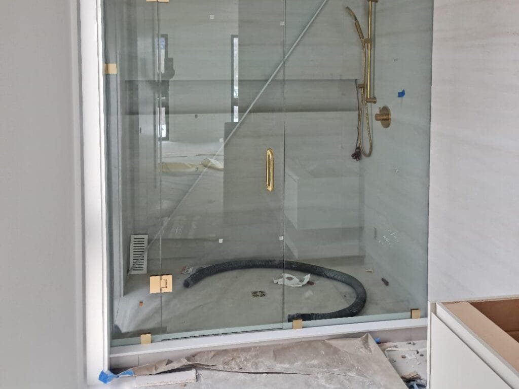 bathroom interior renovation with glass door shower